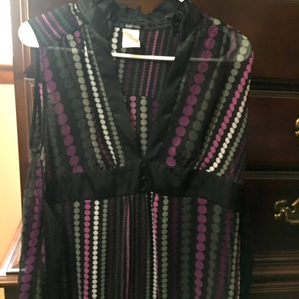 A sleeveless sheer see through blouse